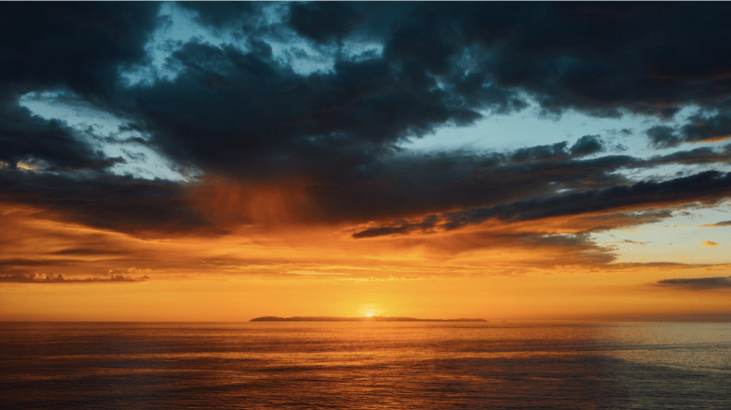 Golden sunset over the Pacific Ocean illustrating the connection between blue spaces and mental health along the San Diego coastline.