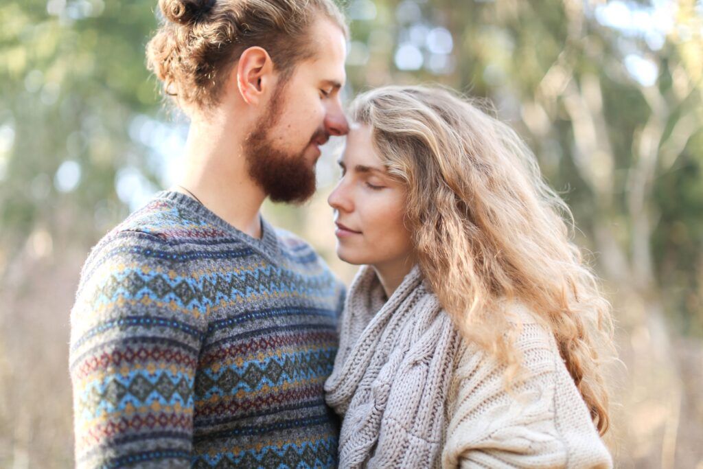 Couple sharing a quiet, affectionate embrace outdoors, illustrating emotional intimacy vs physical intimacy in a healthy relationship.